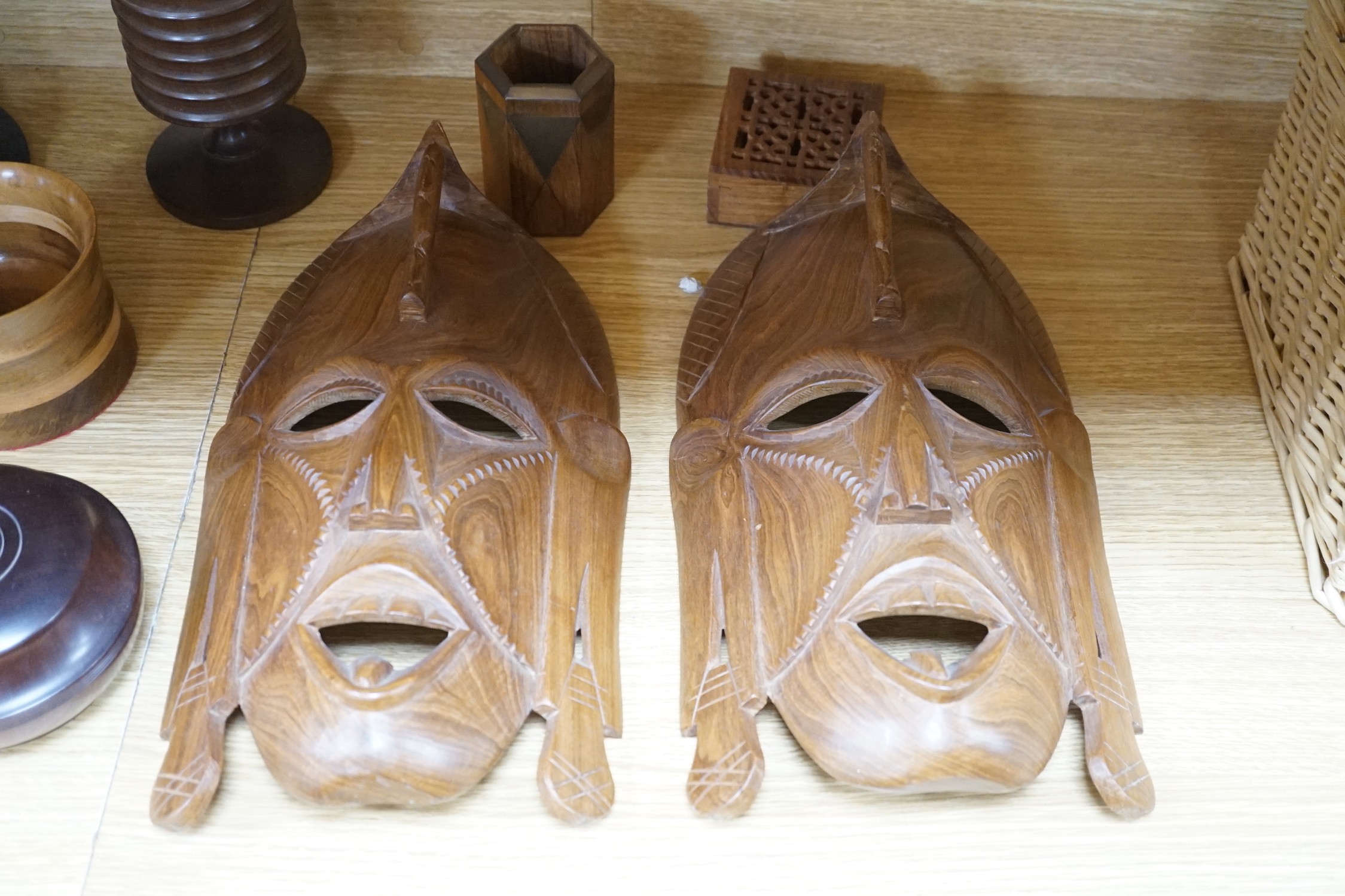 A quantity of African and other carvings including an ostrich egg